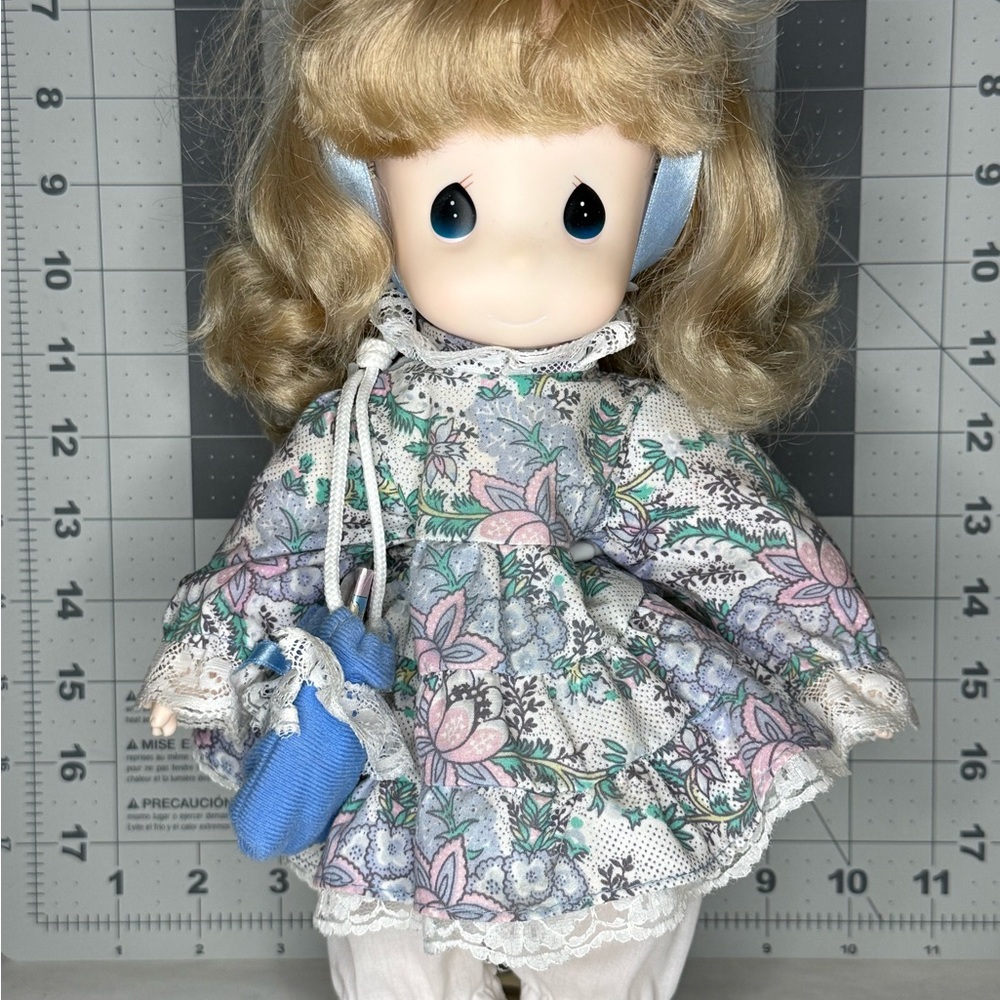 Precious Moments Doll with Floral Dress and Blue Accessories